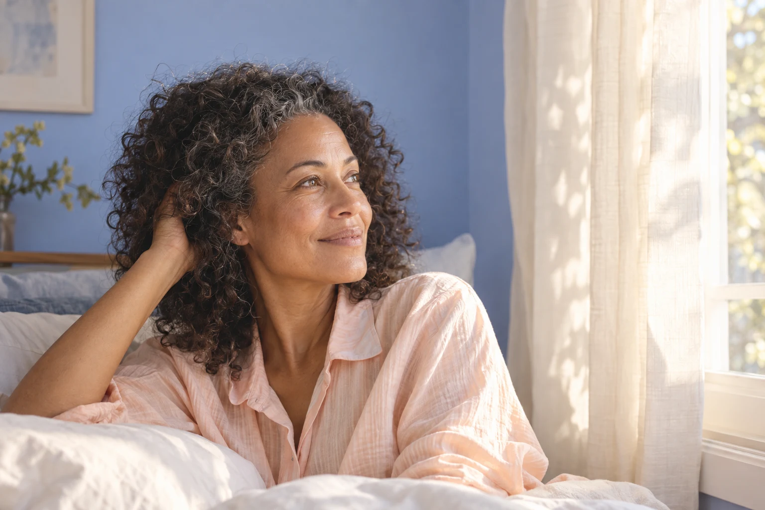 Illustrative portrait of a woman resting by a sunlit bedroom window